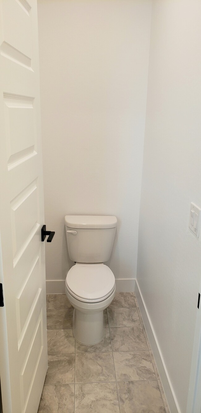 Building Photo - The 2 YEARS NEW 4 bedroom + 3 car garage r...