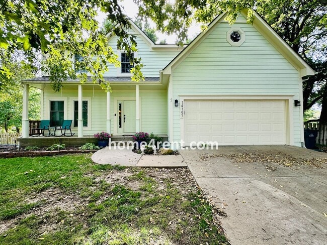 Building Photo - Blue Valley Schools w/ Wood Floors, Finished Basement and a Peaceful, Private Fenced Yard!