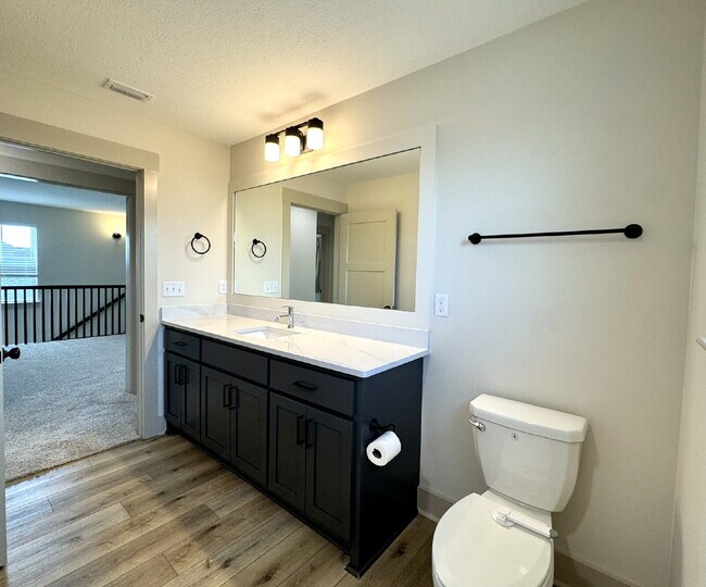 Building Photo - Need Space?  How about 5 bedrooms, 2.5 baths + an extra bonus area upstairs so that the kids can ...