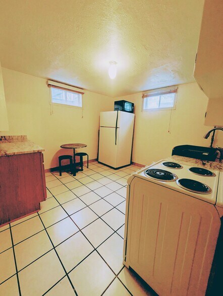 Kitchen includes refrigerator, micro-wave, bistro table - 414 N Avenue E Ave