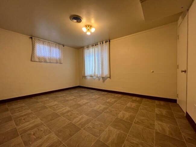 Building Photo - Bi-Level House w/ Massive Backyard, Storage, & Character!