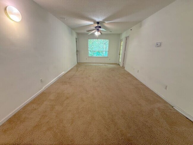 Building Photo - Top floor 4 bed 4 bath condo! On Wolfline, perfect for roommates!