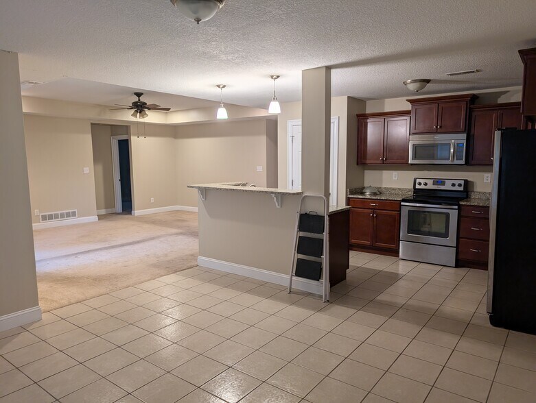 View of kitchen & living room from dining room - 4327 NW 53rd Ter