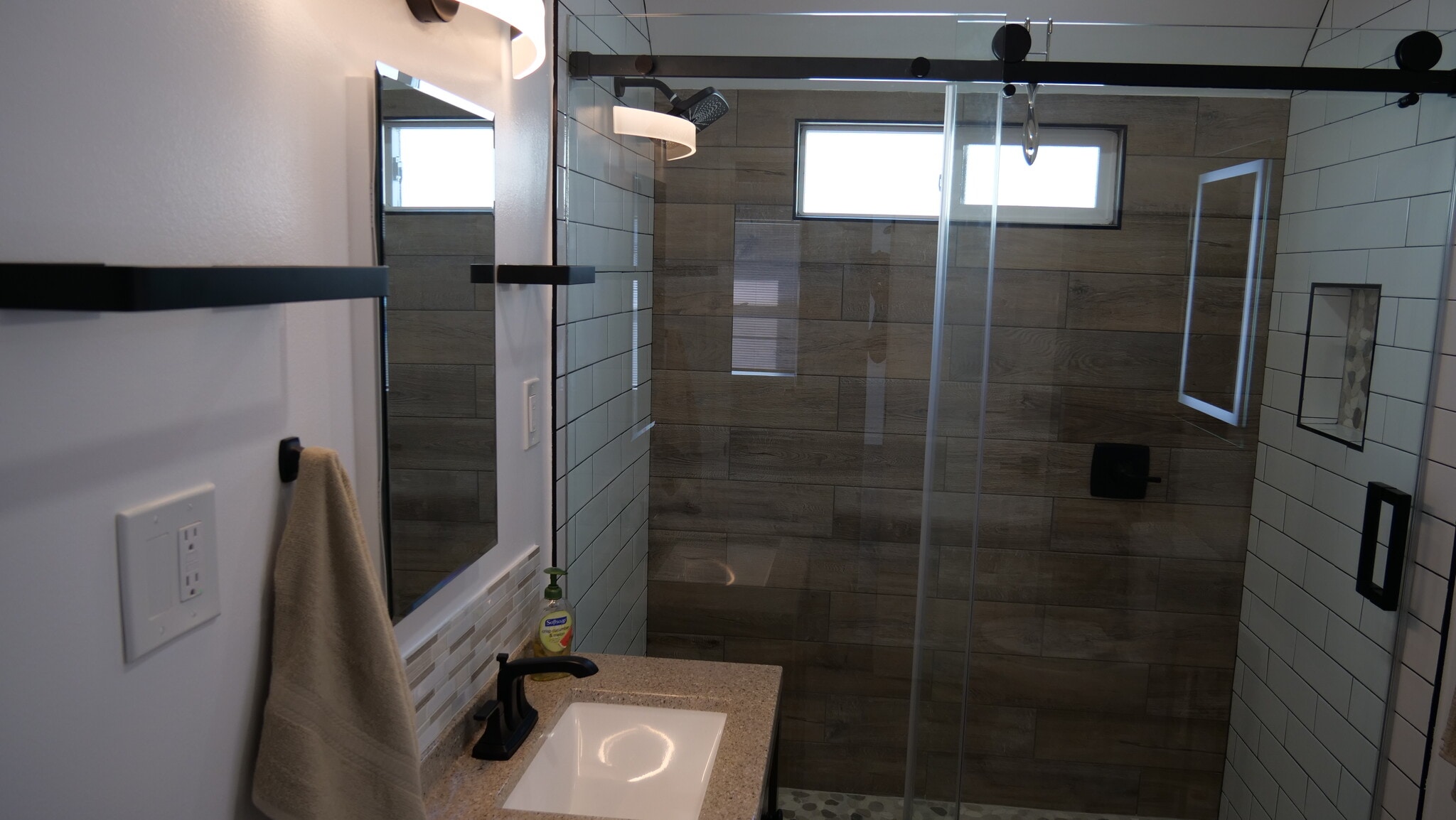 Another view of the shower and medicine cabinet. Notice the water handle in the shower. - 259 E Puente St