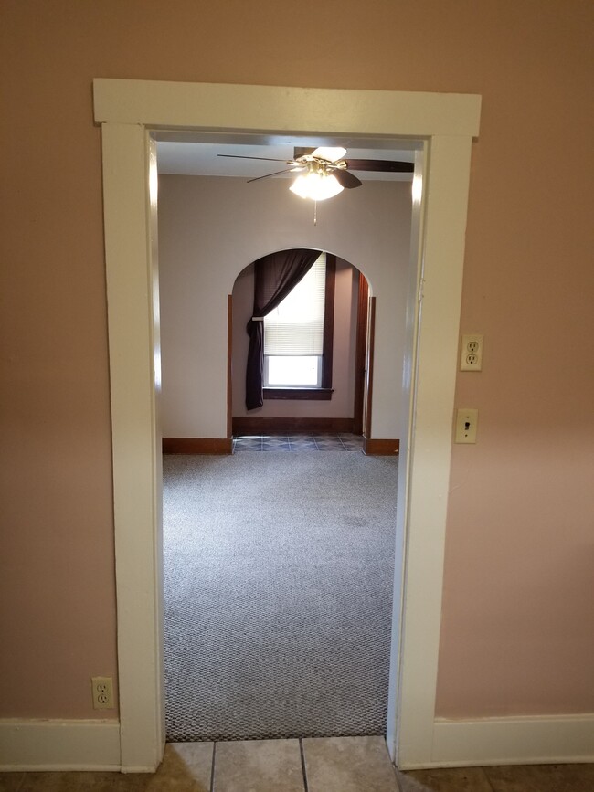 Looking from kitchen through dining room to side entrance - 903 S Cory St