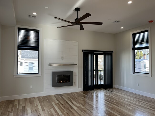 living room with gas fireplace - 16 Pierce St