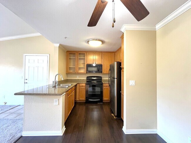 Building Photo - 1BR Condo with Private Balcony, Central A/C & Community Amenities in Corona