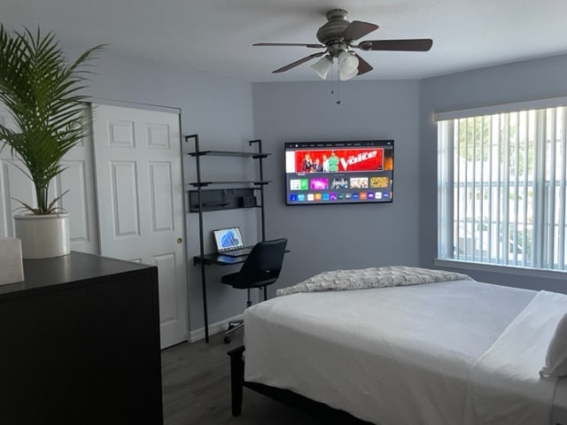 Guest Bedroom with work space and 50-inch flatscreen. - 850 S Tamiami Trl
