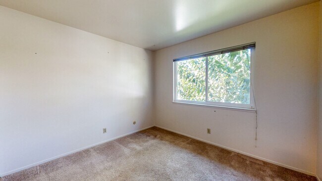 Building Photo - 2 story 2 bedroom 1 bath condo with covered parking, private storage and community pool!