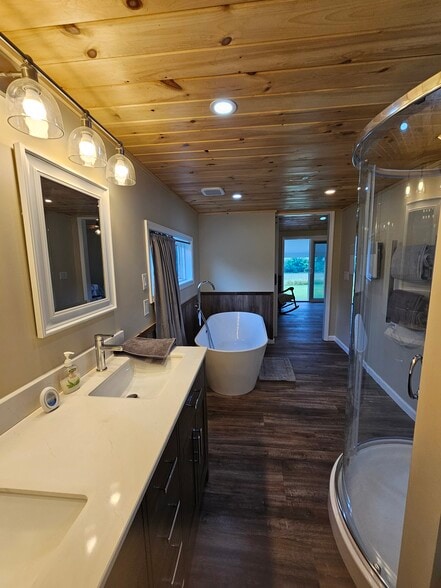 Primary Bath View toward Primary Bedroom Sliding Glass Door to 20 ft Deck - 8152 Wilson Karr Rd