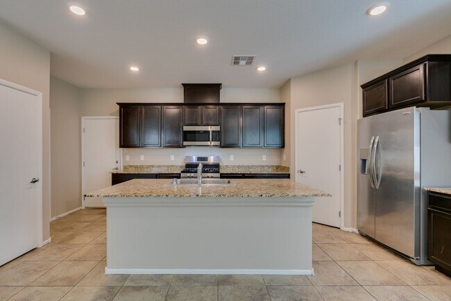 Building Photo - Spacious Townhouse with Loft & Rare 3-Car Garage!