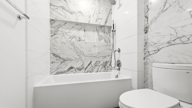 Building Photo - Luxury 1 Bed • 1 Bath at Spire Condominiums