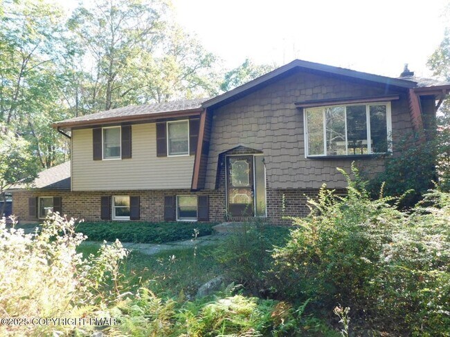 Primary Photo - 3-bedroom, 2-bath home featuring an open f...