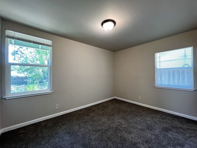 Building Photo - Freshly Renovated 3 Bedroom Home with Large Fenced Yard & Double Garage