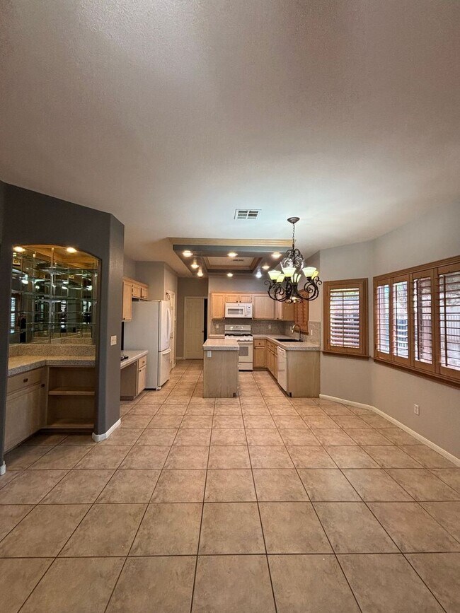 Building Photo - Gated Green Valley Ranch Townhome | 2 Bed | 2.5 Bath | 2-Car Garage
