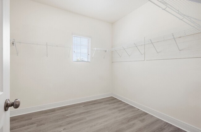 Building Photo - Spacious 6-Bedroom Home Near Lake Nona | 3-Car Garage + Tesla Charger