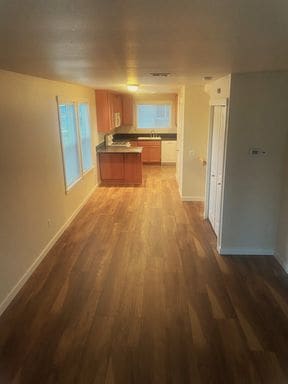 Building Photo - LIKE NEW three bedroom with fantastic updates, one car garage and private newly fenced front patio!