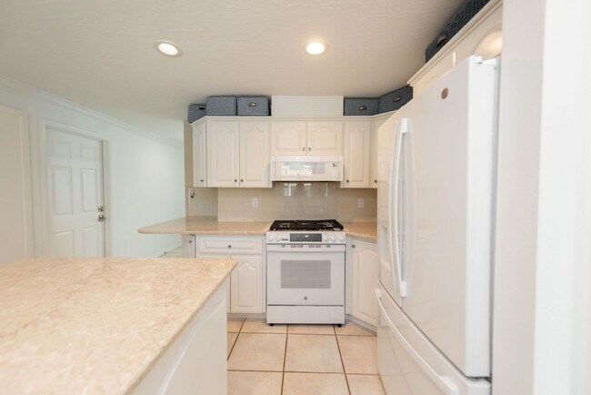 Building Photo - Live the ultimate Space Coast waterfront lifestyle at this stunning beachside canal home in Satel...