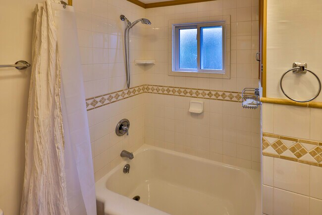 Main bathroom with restored bathtub - 1020 E Garden Ave