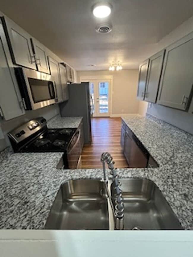 Building Photo - Updated Four Bedroom/Two Bath/Two Car Carport/Fenced/Storage Bldg