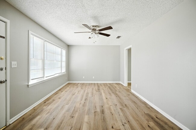 Building Photo - Fresh Paint, New Floors, and a Fresh Start!