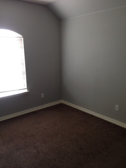 One of the upstairs bedrooms - 7626 Anson Cir