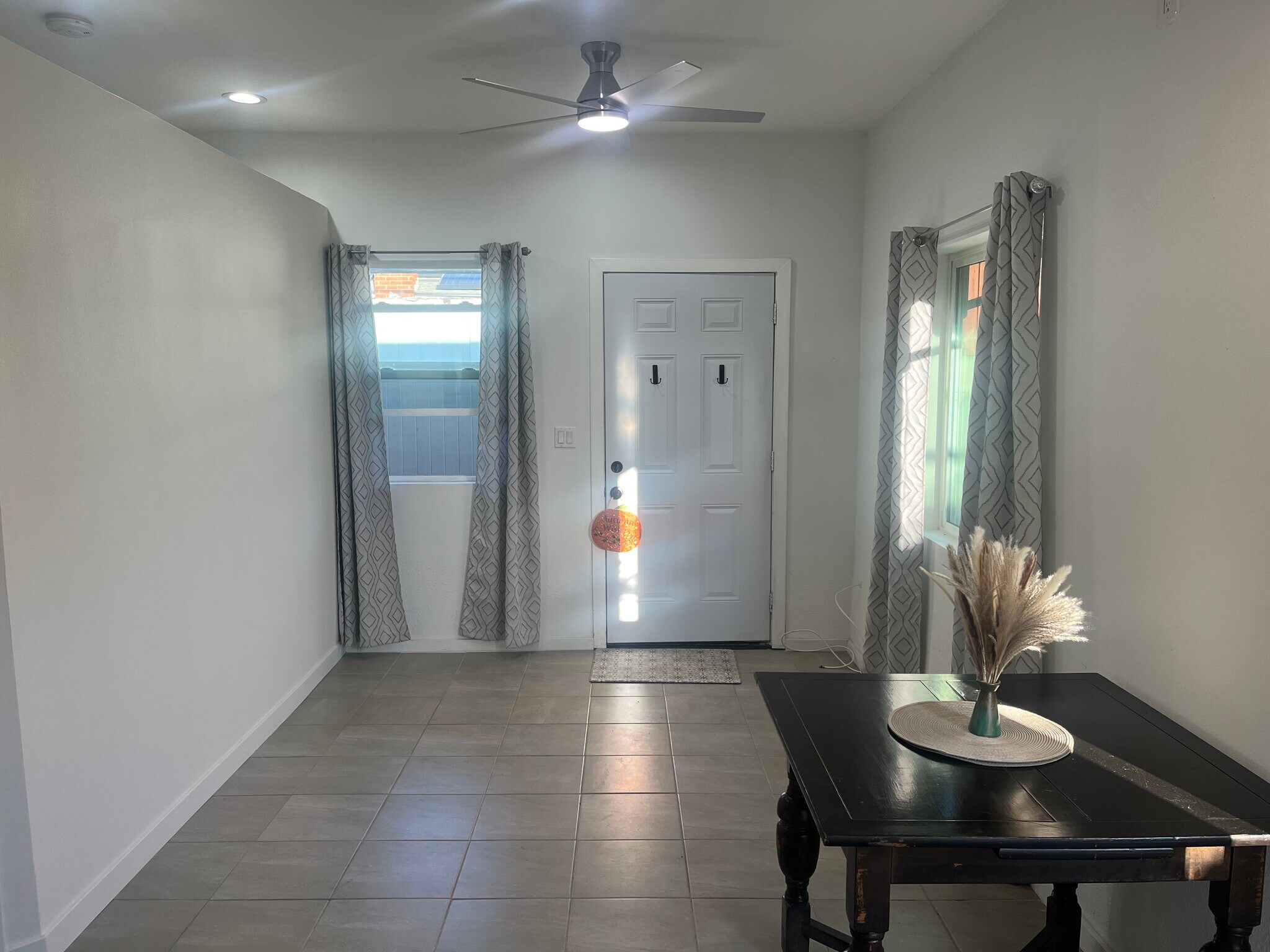 Living area w/lots of natural light! - 10500 Hayvenhurst Ave