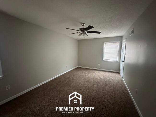 Building Photo - Charming 3BR Memphis Home | Rustic Brick Fireplace, Formal Dining & Fenced Backyard