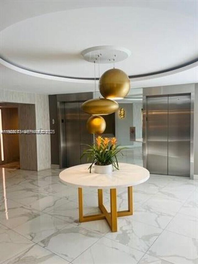 Building Photo - 10275 Collins Ave