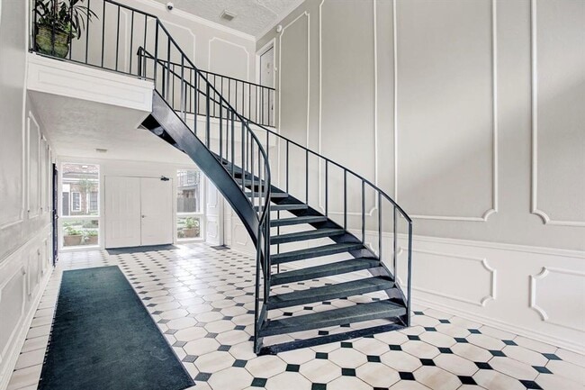 Building Photo - Beautifully remodeled two-story condo in a...