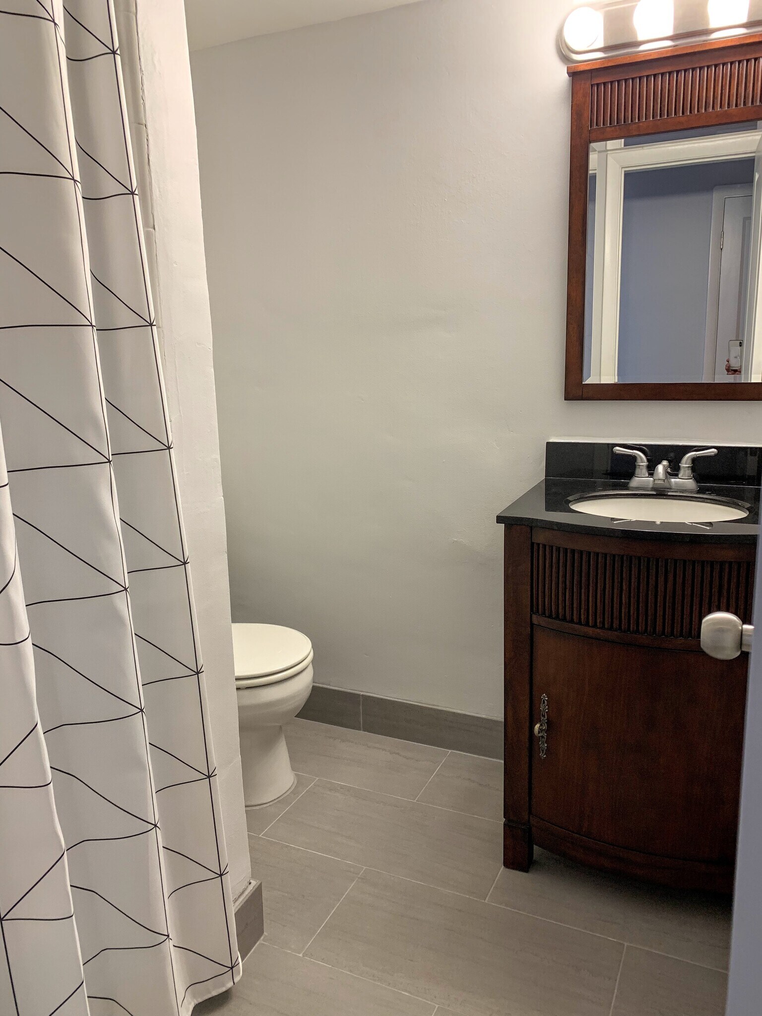 Renovated Guest Bathroom with Spanish Tile Floors - 1400 NE 57th St