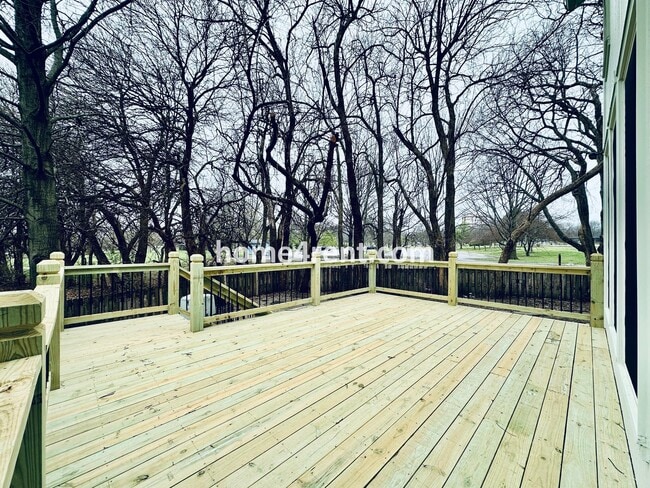 Building Photo - Blue Valley Schools w/ Wood Floors, Finished Basement and a Peaceful, Private Fenced Yard!