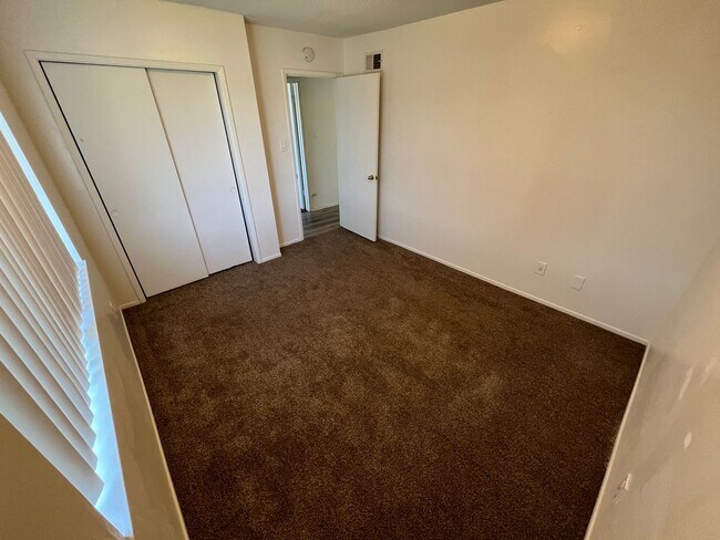 Building Photo - 4 bedroom 2 bath,  fenced yard w/ fruit tr...