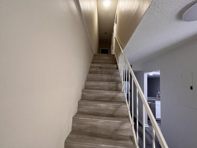 Building Photo - Two-story condominium, featuring 2 bedrooms and 2 1/2 bathrooms