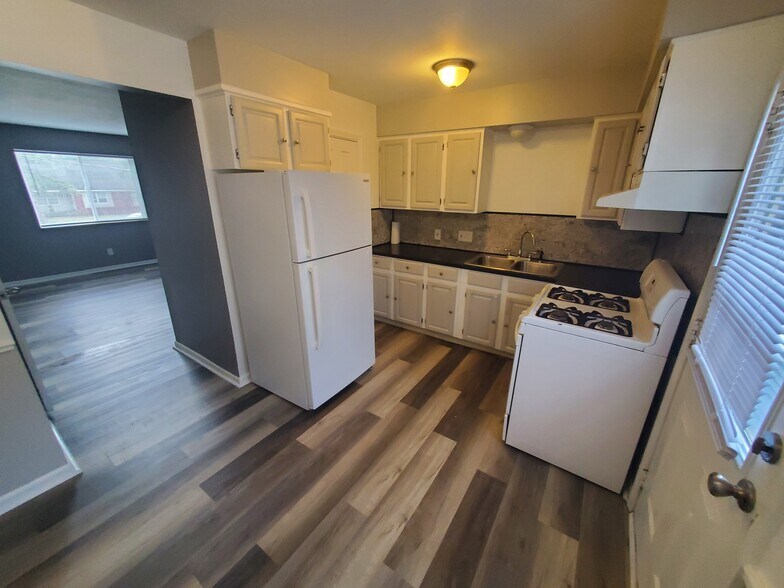 Full kitchen and half bath behind fridge - 5906 Christie Ave SE