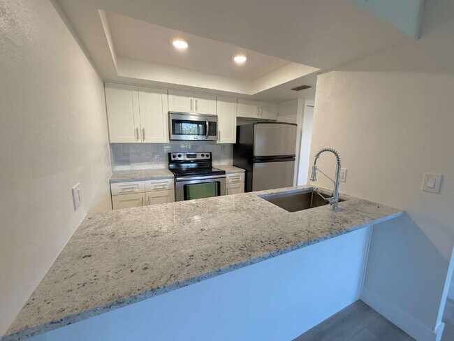 Building Photo - "Charming Clearwater Retreat: Cozy Studio Condo with Scenic Views at Cove Cay!"