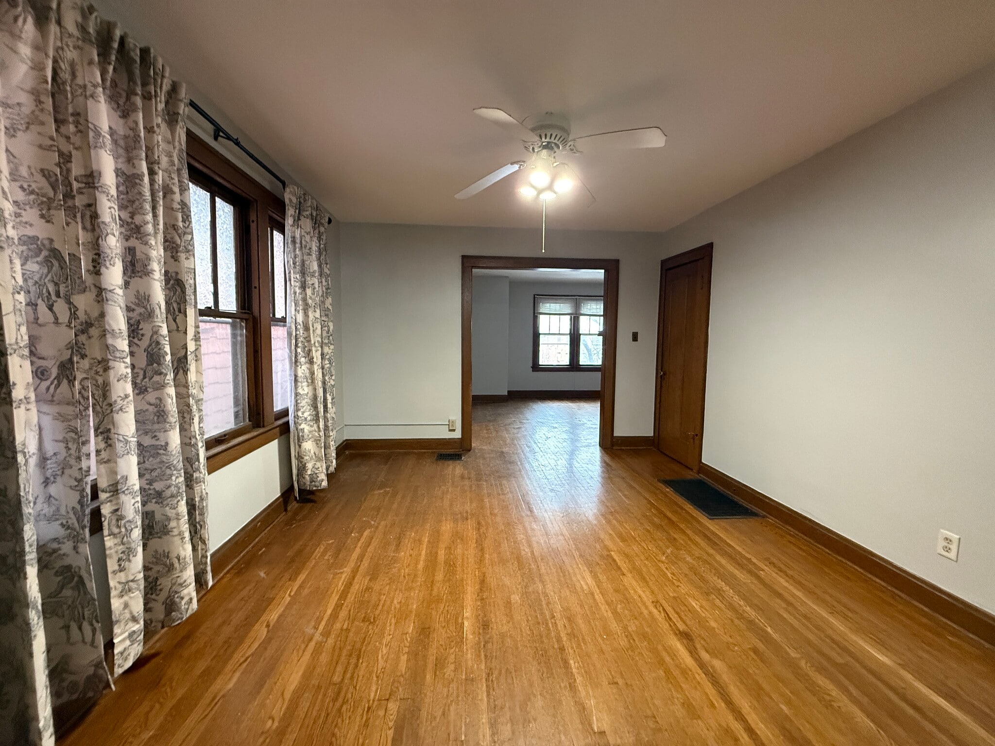 View of dining room from kitchen with LR beyond - 40 W Tompkins St