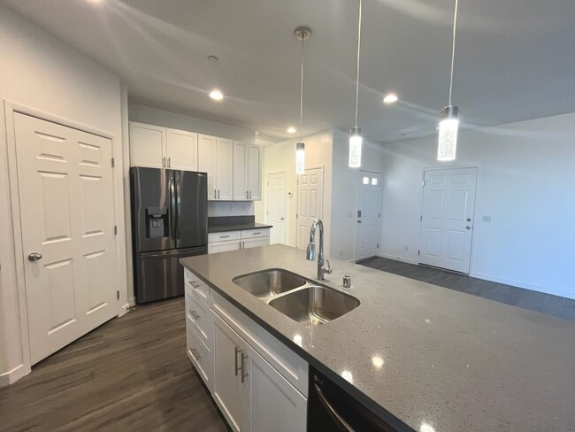 Building Photo - Single-story 1326 sq ft, townhome built in 2019 w/3 bed, 2 bath & spacious attached 2-car garage ...