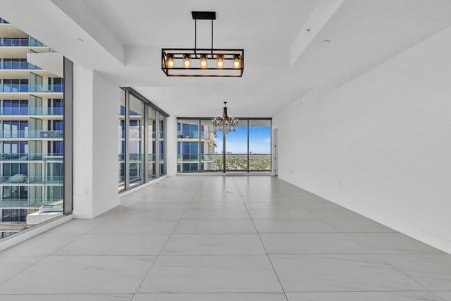 Building Photo - Stunning High-Rise Condo with Ocean Views | Prime Beach Location