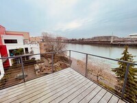 Building Photo - Top Floor 1bdrm Condo with River Views and Private Deck | Most Utilities & Parking Included!