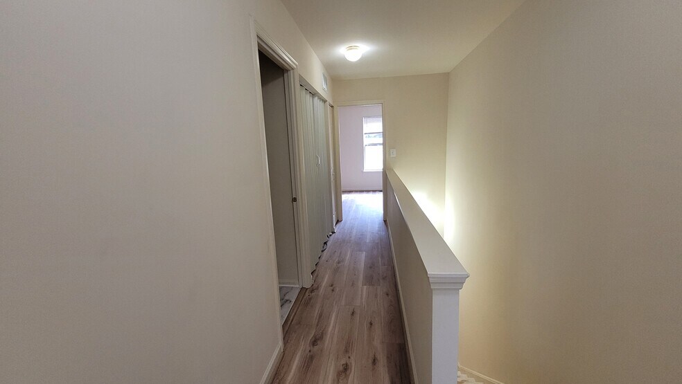 Hall looking toward second bedroom with w/d on the left - 516 Welsh Rd