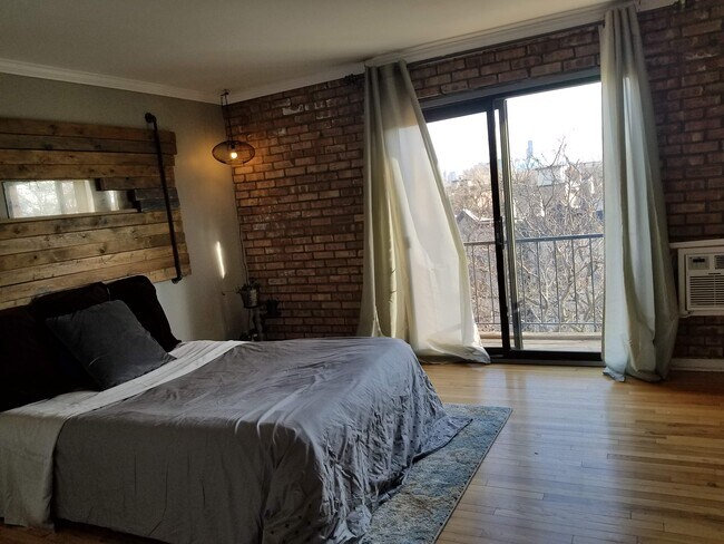 Second Floor Bedroom | Exposed Brick | Balcony | Southern Exposure | Oak Floors - 832 W Oakdale Ave