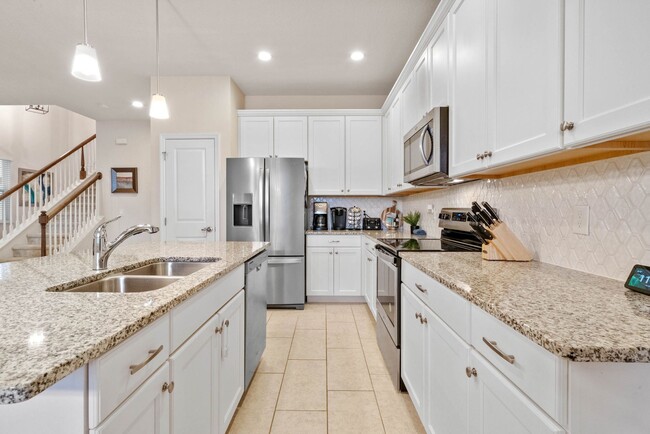 Building Photo - Water Front Home- 4 Large Bedrooms-3 baths Gated Community Call Sheila Campbell 407-687-7900