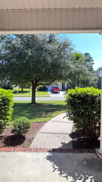 Standing at the front door. - 145 White Dogwood Ln