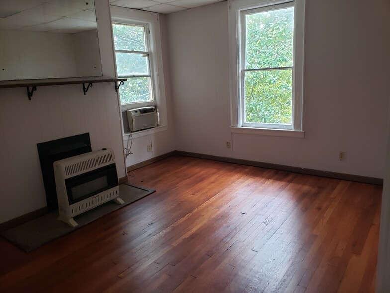 Living Room or Second Bedroom with Gas Heater and Refinished Hardwood Floors - 1542 Quarrier St