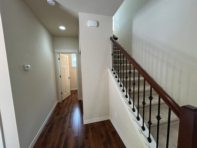 Building Photo - 4 bed/2.5 bath and 3 car garage and a down...
