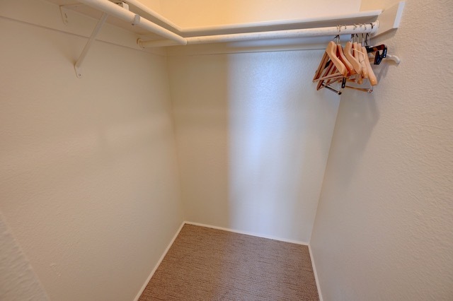 First bedroom walk in closet hanging space - 2210 Miguel Chavez Rd