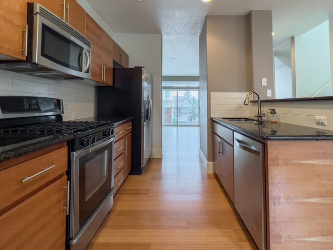 Building Photo - Enjoy this 3 Bedroom 2.5 Bathroom End Townhome ~ 2 Car Garage + Washer & Dryer! Great Cedar Mill ...
