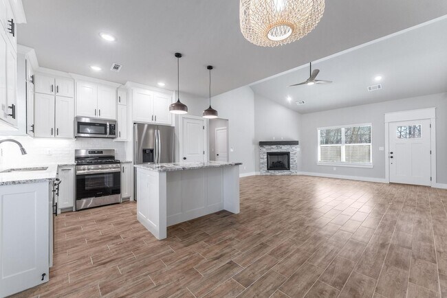 Building Photo - Welcome to this stunning 3-bedroom, 2-bathroom home that boasts a range of high-quality features ...