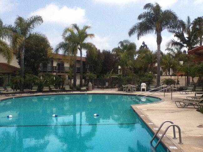 Building Photo - Beautiful Townhome with large fenced back patio, second story balcony, and two covered parking spots